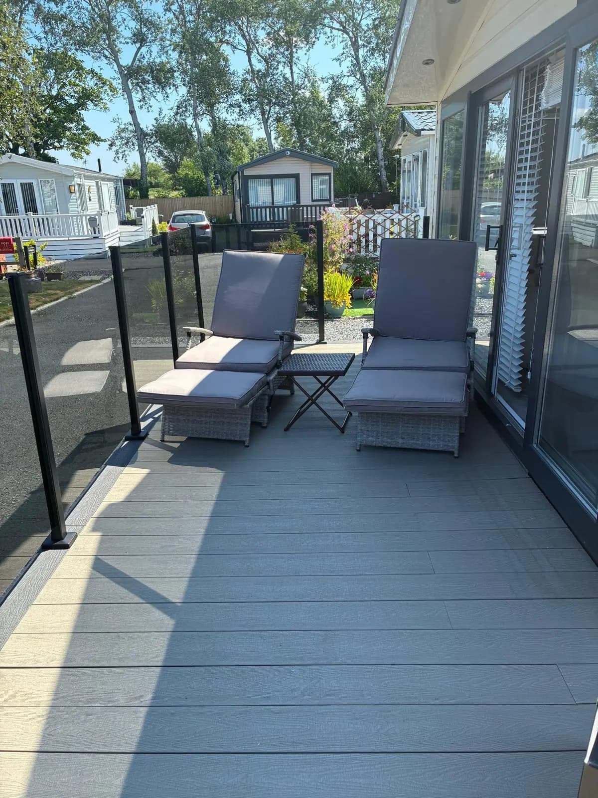 Modern outdoor seating set on grey composite decking